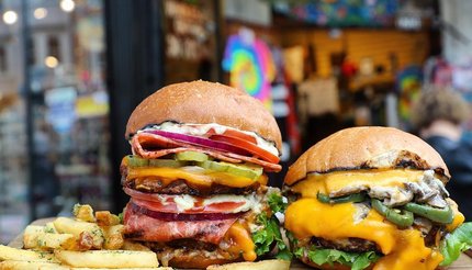 Two plant-based burgers with fries from Veganburg