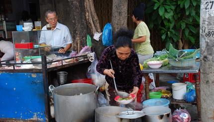 Cooking and selling traditional morning pho bo soup