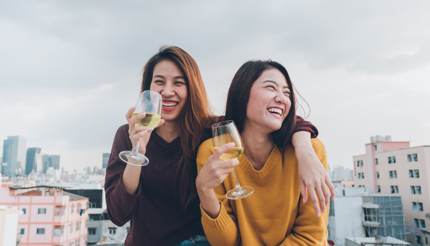 Two women enjoying a delicious glass of locally produced wine.