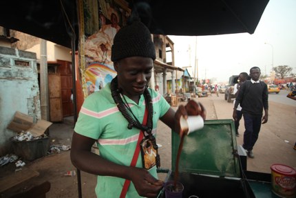 A hawker selling café Touba in Senegal