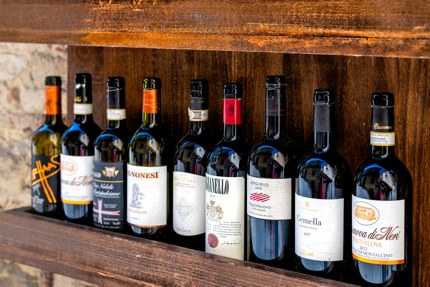 Bottles of red wine on display in Tuscany