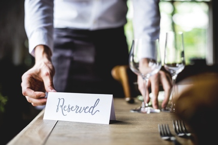 A reserved sign on a restaurant table