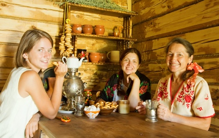 Women having tea, with a samovar on the table