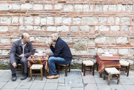 Two Turkish men drinking tea and catching up