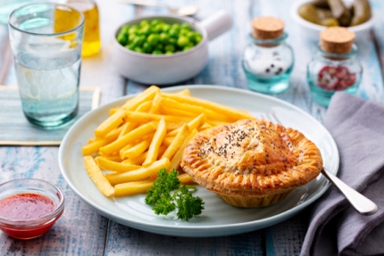 Enjoying delicious pies and chips.