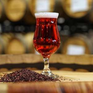 Golden sour beer aged in oak barrels with hibiscus