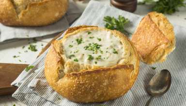 Clam Chowder in bread bowl decorated with parsley