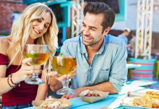 A couple enjoying food & drink