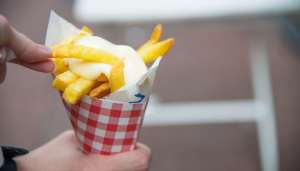 Fries with with mayonnaise, peanut sauce and sometimes onion