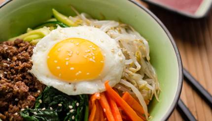 Bibimbap - rice topped with a sunnyside up, seasoned vegetables and beef