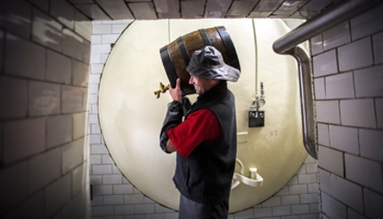 Man holding a barrel of beer - Brewery PernÁtejn