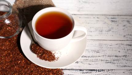 Roibos tea on white wooden board