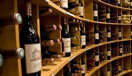 Bottles of wine shelved in L'Inrtendant