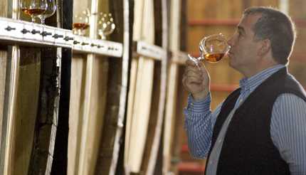 Man drinking brandy fresh from the barrel