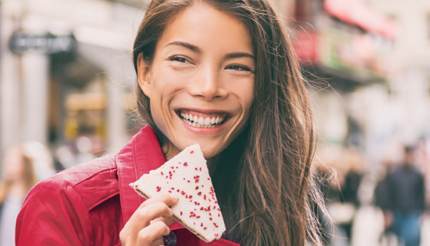 Smiling woman holds Alexandertorte