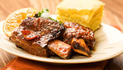 Short rib with cornbread in the background