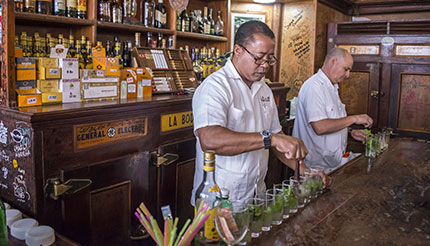 Preparing mojitos at La Bodeguita del Medio